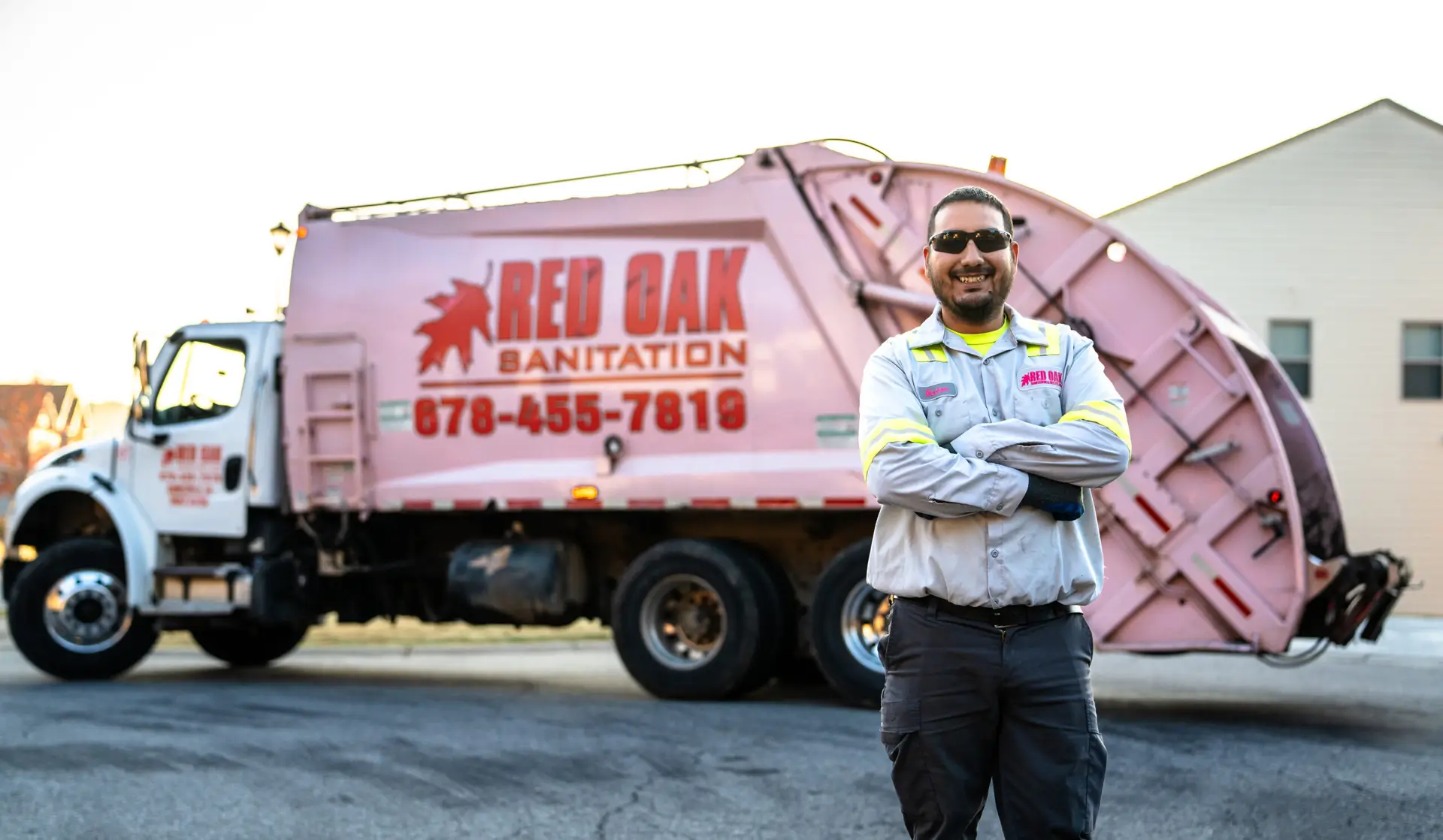 Male in front of Sanitation Truck